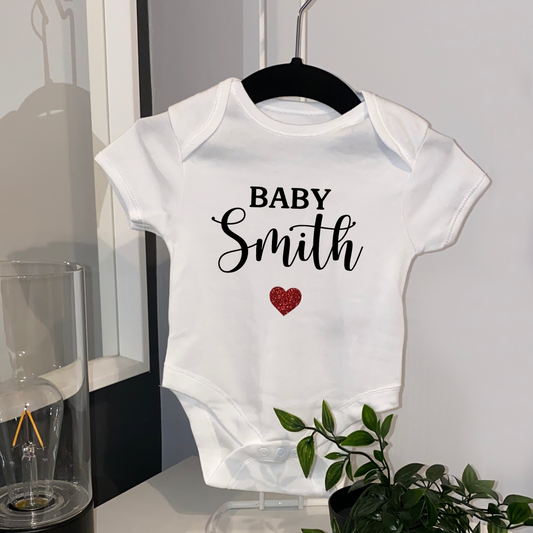 Baby name announcement baby grow with glitter heart